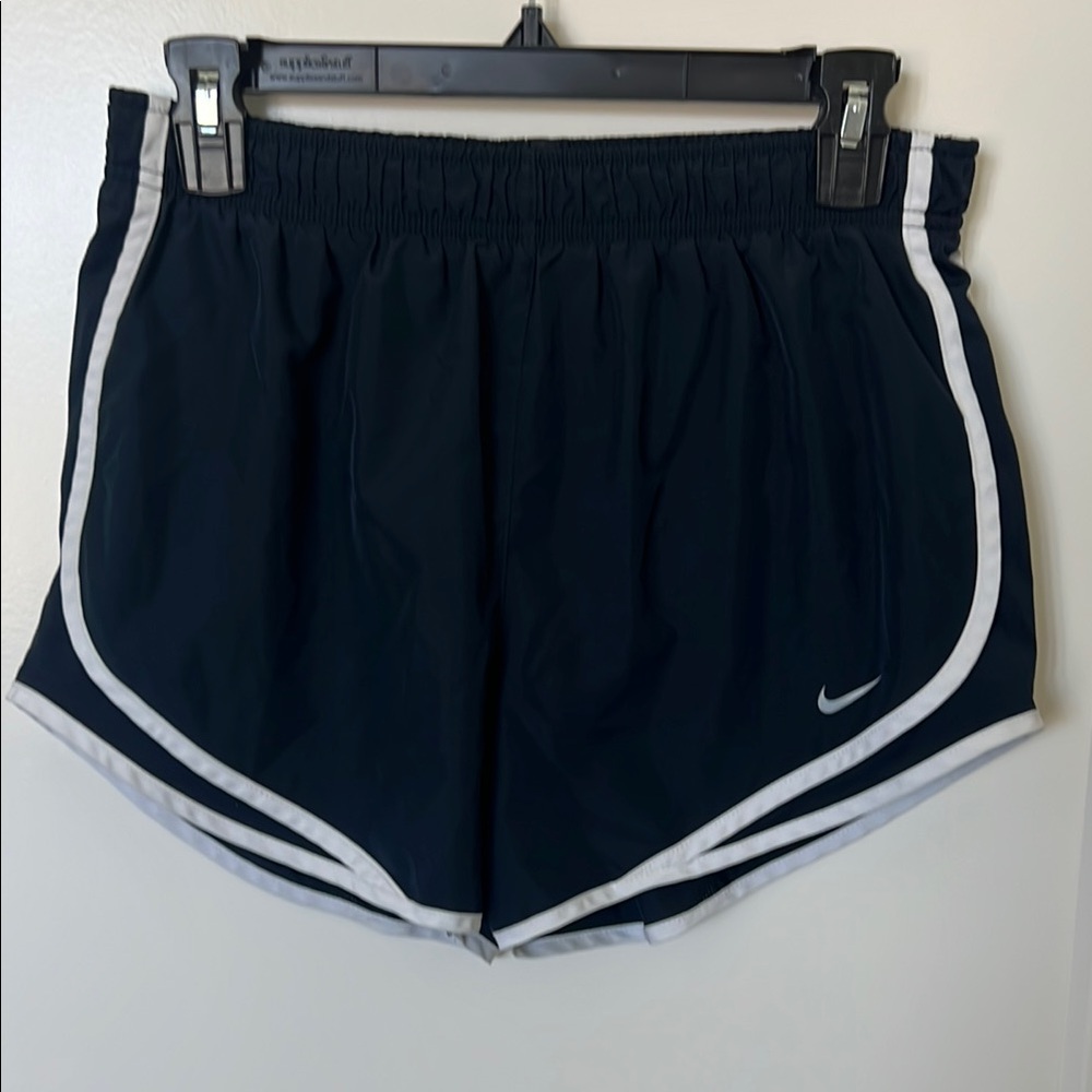 Nike Black Athletic Shorts with Curved Hem and White Trim
